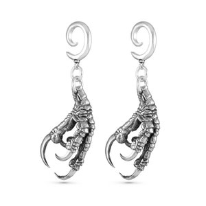 May include: A pair of silver earrings with a detailed claw design hanging from a spiral hoop.