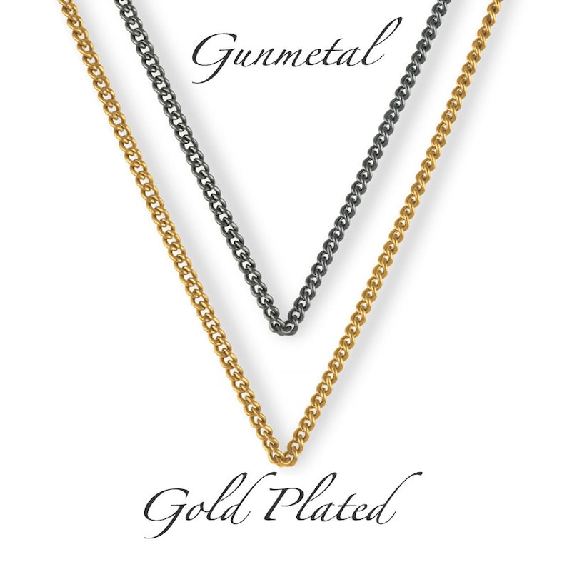 May include: Two chains, one gold plated and one gunmetal, are shown hanging against a white background. The chains are both curb chains.