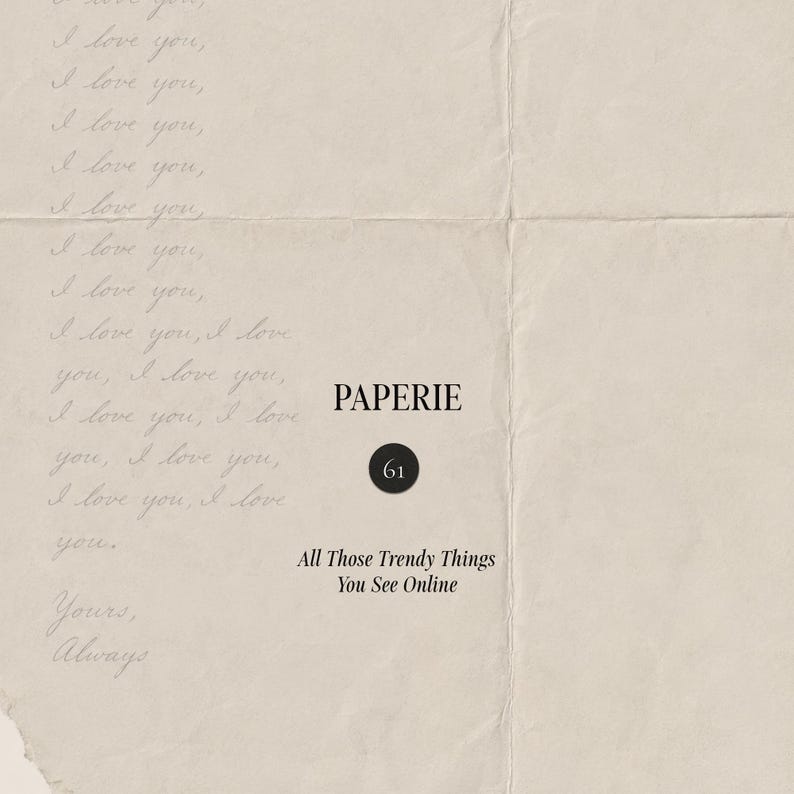 May include: A beige, textured paper background featuring the repeated handwritten phrase I love you. Centered text reads PAPERIE, followed by a black circle containing the number 61, and the text All Those Trendy Things You See Online.
