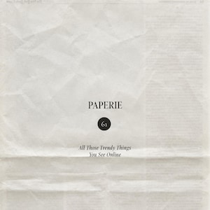 May include: A piece of off-white, textured, creased paper featuring the black text PAPERIE, a black circle containing the number 61, and the text All Those Trendy Things You See Online centered in a serif font on the surface.