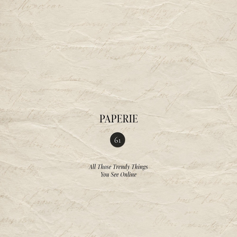 May include: A beige, textured paper background featuring faint, cursive handwriting. Centered text reads PAPERIE, followed by a black circle containing the number 61, and the text All Those Trendy Things You See Online in a serif font.