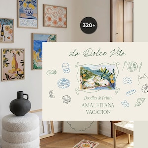 May include: Several framed art prints with a coastal theme, featuring illustrations of lemons, bottles, and landscapes. The prints are displayed on a white wall, with a black vase and a round, white ottoman. The text "La Dolce Vita" is visible.
