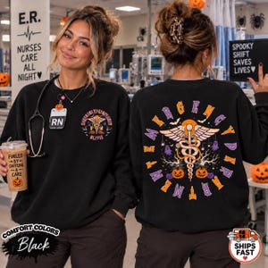 May include: A black crewneck sweatshirt featuring a small graphic on the front left chest and a large graphic on the back. Both designs display a caduceus symbol, pumpkins, ghosts, and bats. The back text reads EMERGENCY DEPARTMENT in a circular font.