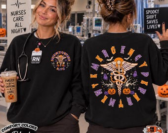 May include: A black crewneck sweatshirt featuring a small graphic on the front left chest and a large graphic on the back. Both designs display a caduceus symbol, pumpkins, ghosts, and bats. The back text reads EMERGENCY DEPARTMENT in a circular font.