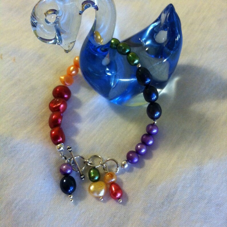 Pearl Bracelet with Rainbow Charm.