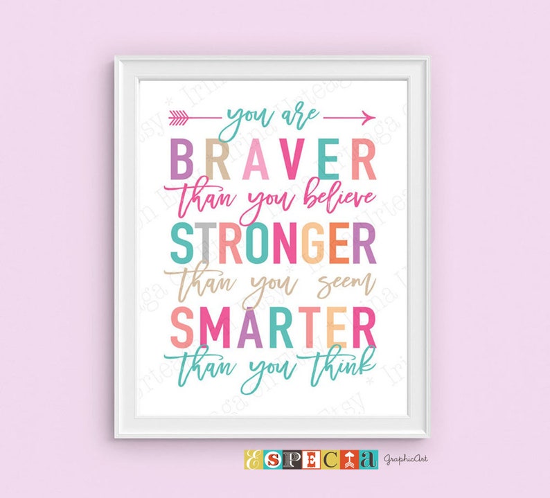 May include: A framed print with a white border features colorful text on a white background. The text reads "You are Braver than you believe, Stronger than you seem, Smarter than you think." The print has a pink background.