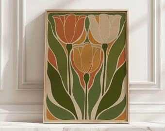 May include: A framed art print featuring a stylized floral design. The artwork showcases three tulips in shades of orange, yellow, and cream, set against a backdrop of green and orange leaves. The print is in a wooden frame, creating a vintage aesthetic.