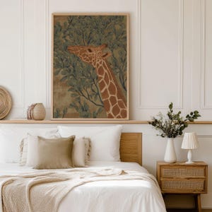 Gentle giraffe portrait in green and brown with botanical leaves, classic illustrated style and soothing mood, displayed as a framed wall art print above a neatly made bed.
