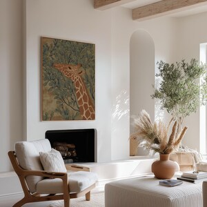Elegant giraffe among leaves in green and brown, calm museum-style illustration feel, shown as a framed art print on a neutral wall in a contemporary lounge.