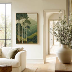 Slender trees before rolling green hills in a Japanese woodblock-inspired, peaceful poster, styled in an airy living room scene.