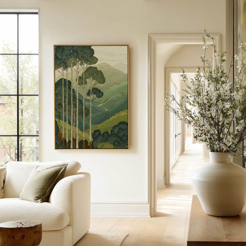 Slender trees before rolling green hills in a Japanese woodblock-inspired, peaceful poster, styled in an airy living room scene.