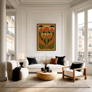Striking vintage tulip cluster in earthy orange and green poster displayed in a large frame above a sofa in a bright living room with tall windows.