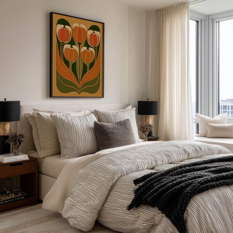 Warm retro tulip floral artwork in orange and green hues wall art print hanging above a neatly made bed in a modern neutral bedroom.