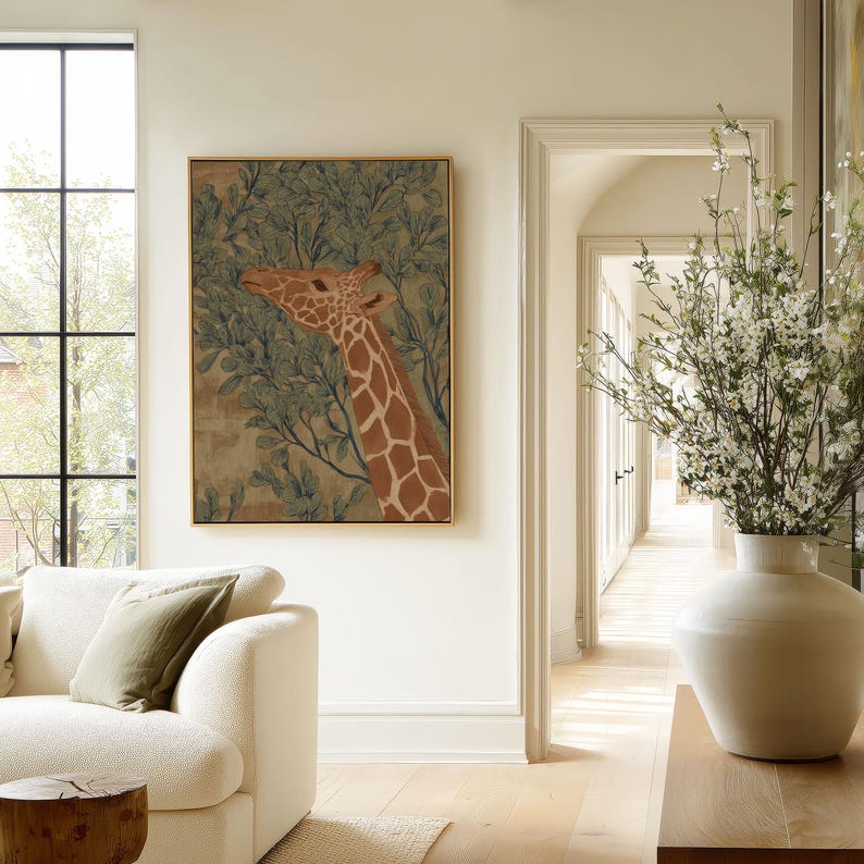 Vintage-style giraffe in green and brown framed by foliage, quiet and earthy mood, presented as a framed poster in an airy living room near an archway.