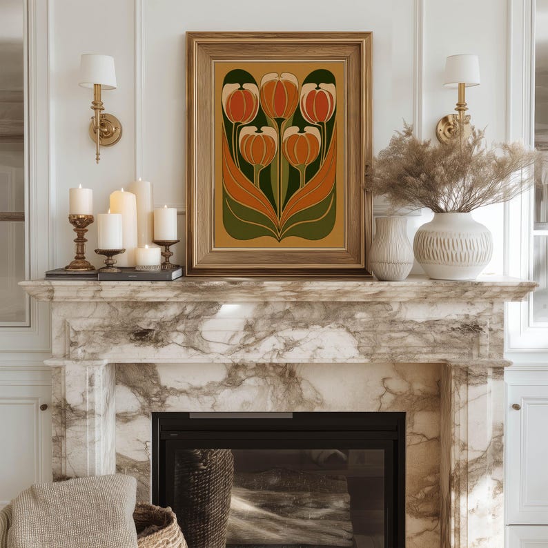 Ornate stylized tulip composition in orange and green art print centered above a marble fireplace decorated with candles and vases.