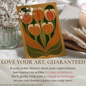 Vintage-inspired orange and green tulip bouquet artwork art print resting near flowers and a candle with a Love your art guaranteed refund message.