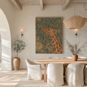 Muted green-and-brown giraffe foliage illustration, vintage inspired and peaceful, featured as a framed poster above a round dining table with woven lighting.