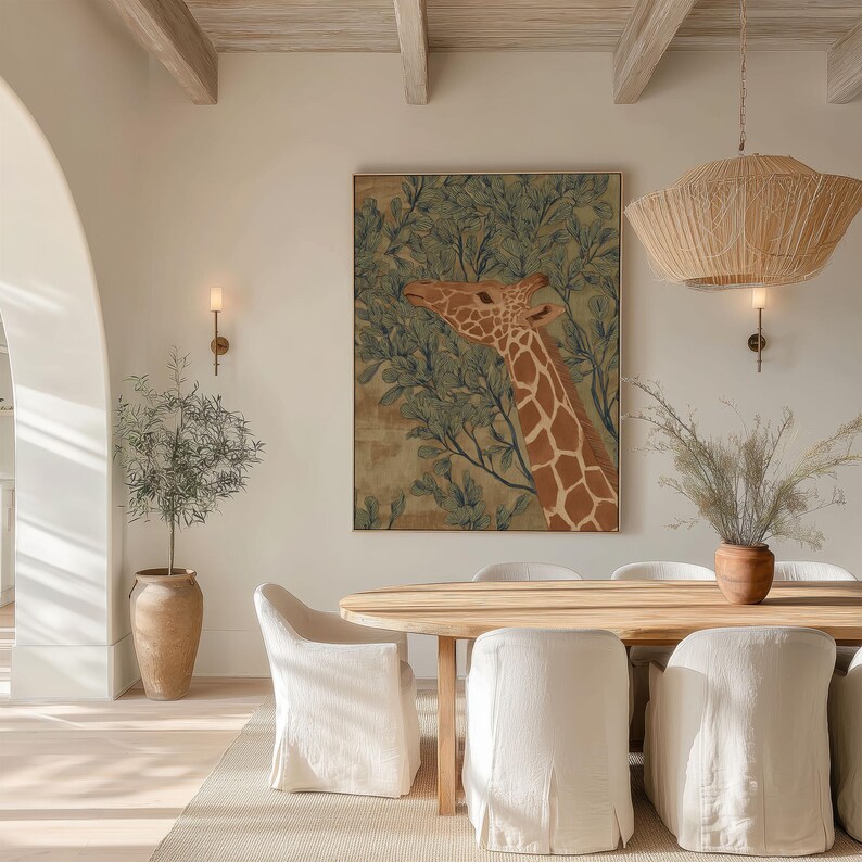 Muted green-and-brown giraffe foliage illustration, vintage inspired and peaceful, featured as a framed poster above a round dining table with woven lighting.