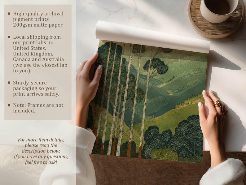 Green mountain landscape with tall trees in a calm, vintage-style art print, shown being unrolled on a tabletop with matte paper info panel.