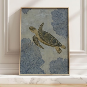 May include: Framed art print featuring a sea turtle swimming in a serene aquatic scene. The artwork showcases a detailed turtle with a green and tan shell, set against a backdrop of blue coral-like shapes and a textured, light blue background. The frame is a warm, natural wood tone.