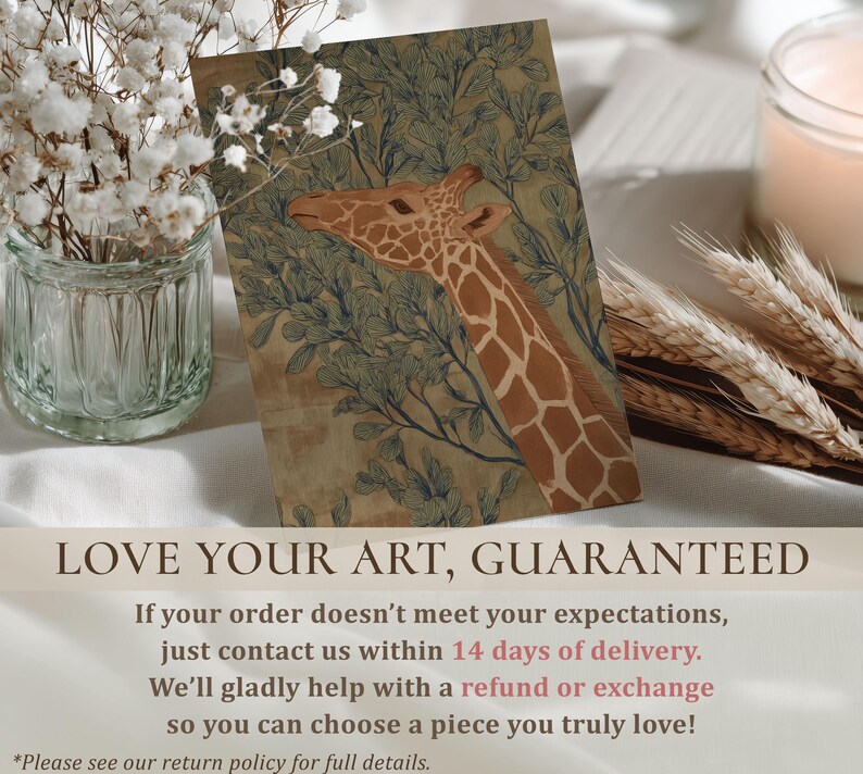 Soft green-and-brown giraffe foliage illustration, vintage naturalist style and peaceful mood, presented as a wall art print on a styled tabletop with florals and guarantee text.