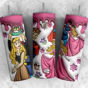 May include: Three stainless steel tumblers with pink drip designs and cartoon illustrations. The designs feature characters from a fairy tale, including a princess in a pink dress and a prince. The tumblers have silver straws.