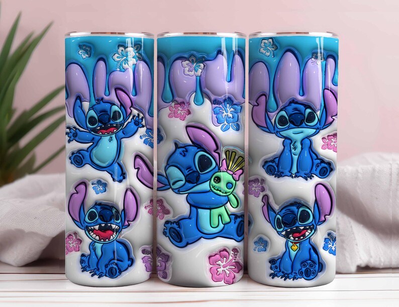 May include: Three stainless steel tumblers featuring the character Stitch from Lilo & Stitch. The tumblers have a white base with blue Stitch illustrations, purple accents, and a blue and purple drip design. Pink and blue floral accents complete the design.