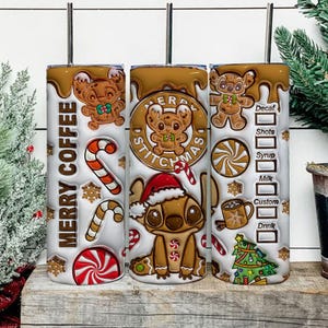 May include: Three white insulated tumblers with a brown, gingerbread-themed design. The tumblers feature the text "MERRY COFFEE" and "MERRY STITCHMAS" with gingerbread Stitch characters, candy canes, and snowflakes. One tumbler has a coffee customization menu.