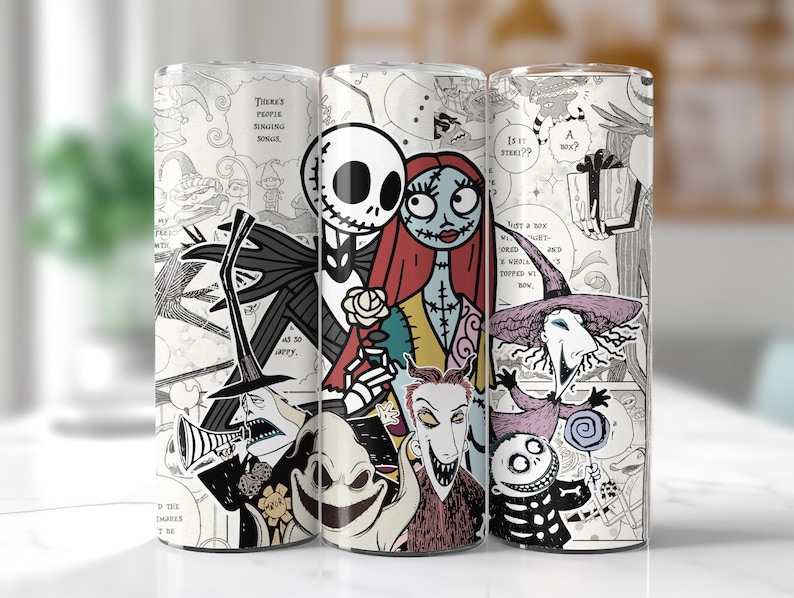 May include: Three tall, cylindrical tumblers feature illustrations of characters from The Nightmare Before Christmas. Jack Skellington, Sally, and other characters are depicted in a black and white comic book style. The tumblers are on a white surface.