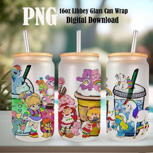 May include: Three frosted glass can wraps with bamboo lids and stainless steel straws. Each features colorful cartoon characters, including My Little Pony, Strawberry Shortcake, Care Bears, and Smurfs. The text "PNG 16oz Libbey Glass Can Wrap Digital Download" is at the top.