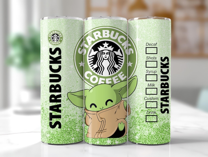 May include: A green and white Starbucks tumbler featuring the Starbucks logo, the text "STARBUCKS", and a cartoon image of a green alien character. The tumbler has a glittery design and a drink customization chart.