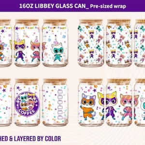 May include: A selection of 16oz Libbey glass cans with pre-sized wraps. The designs showcase cartoon cats in superhero costumes and party hats, with colourful confetti and star patterns. Some cans have Starbucks and coffee logos.