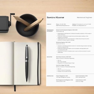 May include: A resume for Samira Alcaraz, a Mechanical Engineer, with contact information, professional experience, education, and certifications. A black pen rests on an open notebook, with a pencil sharpener and pencils in the background.