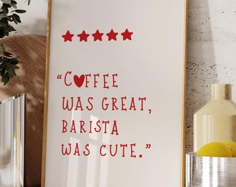 May include: A framed print with the text "Coffee was great, barista was cute" in red. The print has five red stars at the top and is in a gold frame. The print is on a white background.