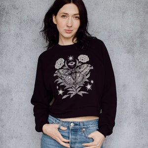 Moth Eye Floral Shrine Crop Crew Neck Black Sweatshirt