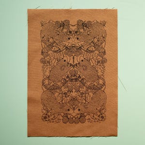 May include: A brown fabric panel with a black and white print of stylized mice and berries. The mice are arranged in a symmetrical pattern, with their tails intertwined.