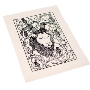 May include: Black and white line art print of a lion's head with horns, surrounded by stylised floral vines. The print is on a white canvas.