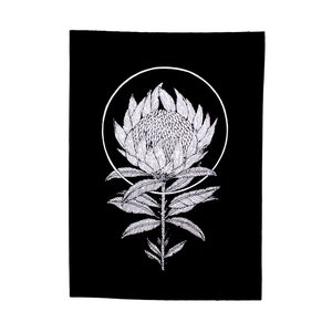 May include: A black and white line drawing of a protea flower with a circle around it. The flower is in the center of the image and the circle is around it.