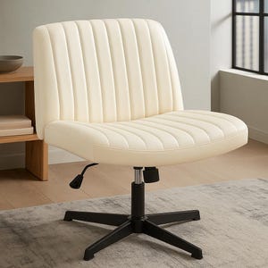 May include: Cream-colored office chair with a ribbed back and seat. The chair has a black, five-star base and a lever for height adjustment. The chair is designed for comfort and support, suitable for a home office or workspace.