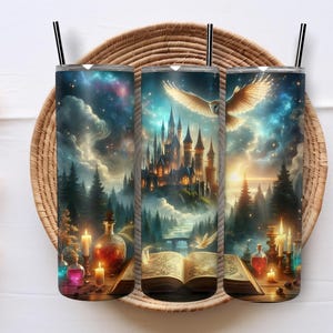 May include: Three stainless steel tumblers with black straws, each featuring a fantasy scene. The design includes a castle, an owl, and an open book, set against a starry sky and forest. Candles and potion bottles are also visible.