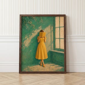 May include: A framed wall art print depicting a person in a mustard yellow dress standing against a teal wall, holding an open yellow book in front of their face. The scene includes a window with light casting shadows of leaves on the wall.