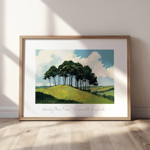 May include: A framed landscape print featuring a cluster of dark green trees atop a rolling grassy hill under a blue sky with white clouds. The text "Nearly There Trees - Cornwall, England" is printed in a script font at the bottom of the image.