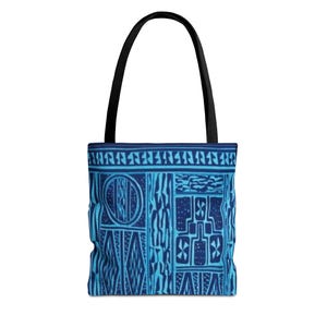 May include: A tote bag featuring a repeating geometric pattern in shades of dark and light blue. The design includes vertical panels with abstract shapes, circles, and diamonds, topped by a horizontal border. It has two black fabric shoulder straps.