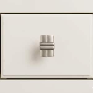 May include: A close-up of a white drawer with a brushed nickel cabinet knob. The knob has a rectangular shape with horizontal and vertical lines, providing a modern aesthetic. The drawer is part of a larger piece of furniture.