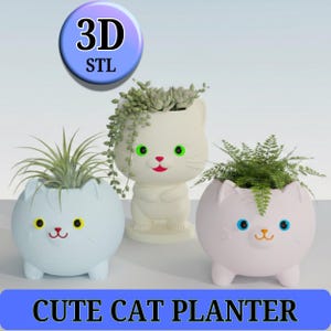 May include: Three cat-shaped planters in white, light blue, and pink, each with a different plant. The planters have cat faces with yellow, green, and blue eyes, and red or orange mouths. The text "CUTE CAT PLANTER" is at the bottom.