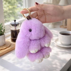 May include: A set of three ceramic mugs with a speckled, matte finish. The mugs are in shades of cream, light gray, and dark gray. Each mug has a simple, minimalist design, perfect for coffee or tea.