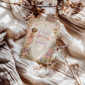 May include: A whimsical invitation for a "Magical Fairy" birthday party, featuring a fairy illustration in shades of pink and purple. The invitation includes event details and decorative floral elements.