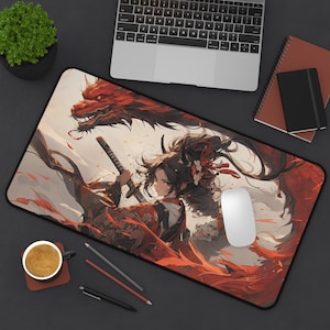 May include: A rectangular desk mat featuring an illustration of a person with dark hair holding a katana, accompanied by a large red dragon. The artwork uses a color palette of red, black, and white, with flowing lines and floral hair accessories.