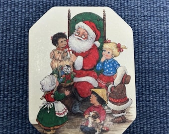 Lata metálica coleccionable vintage de Papá Noel navideño