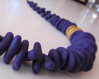 purple, gold colour block crazy circles and anemone shaped polymer beaded necklace